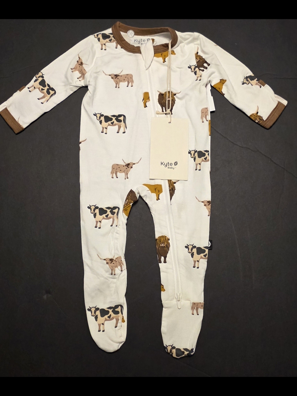 Kyte Baby Cream Cow-Print Organic Footed One-Piece